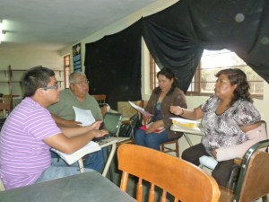 Pastor Agustin Martinez of Salem, OR (in green shirt) participates in small group working on exegesis of the book of Ruth
