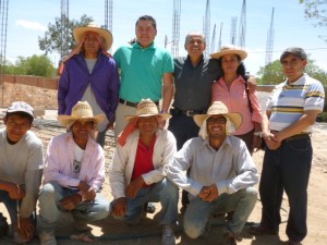 Ramiro Ortiz in  the turquoise shirt stands next to Pastor Rosendo Arvizu Avalos (l.) and wife Olivia