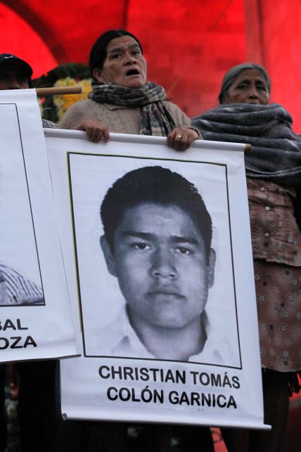 Is she a mother? an Aunt? an Activist? Whoever she may be, she holds this Ayotzinapa student in her heart.