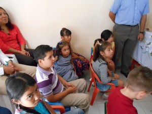 Children sit in front and participate in worship