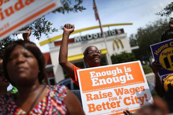 Outside a McDonald’s in Fort Lauderdale, Florida, protesters rally in support of a $15 an hour minimum wage. Photo by Joe Raedle/Getty Images